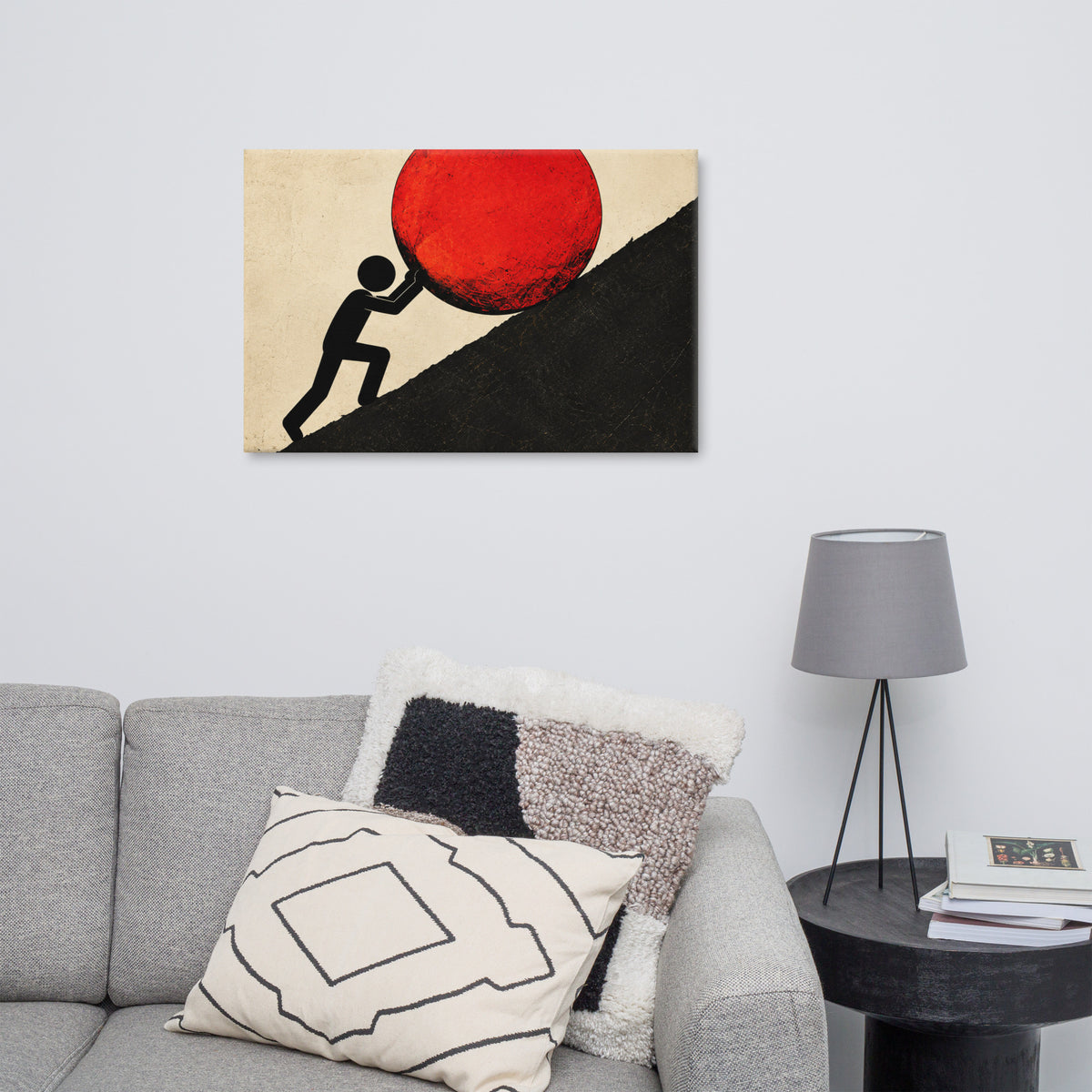 UPHILL canvas displayed in a room, with a red circle and a black figure on a steep incline.
