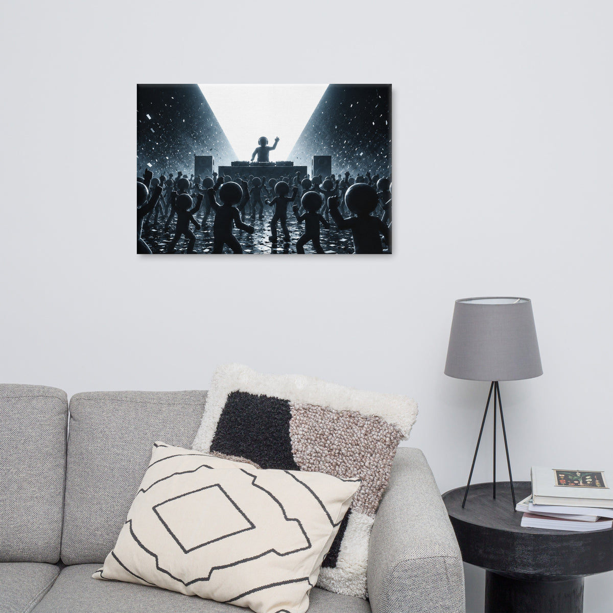 WHITE NOISE black-and-white canvas displayed in a room, with a DJ and a crowd beneath a beam of light.